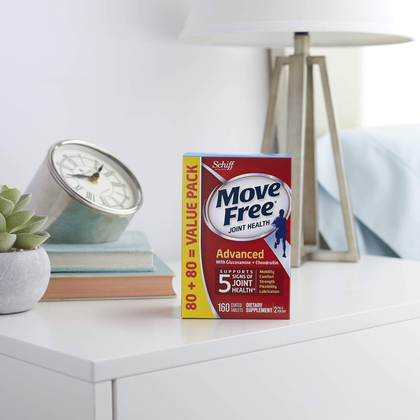Move-Free Advanced supplements on a bedside table