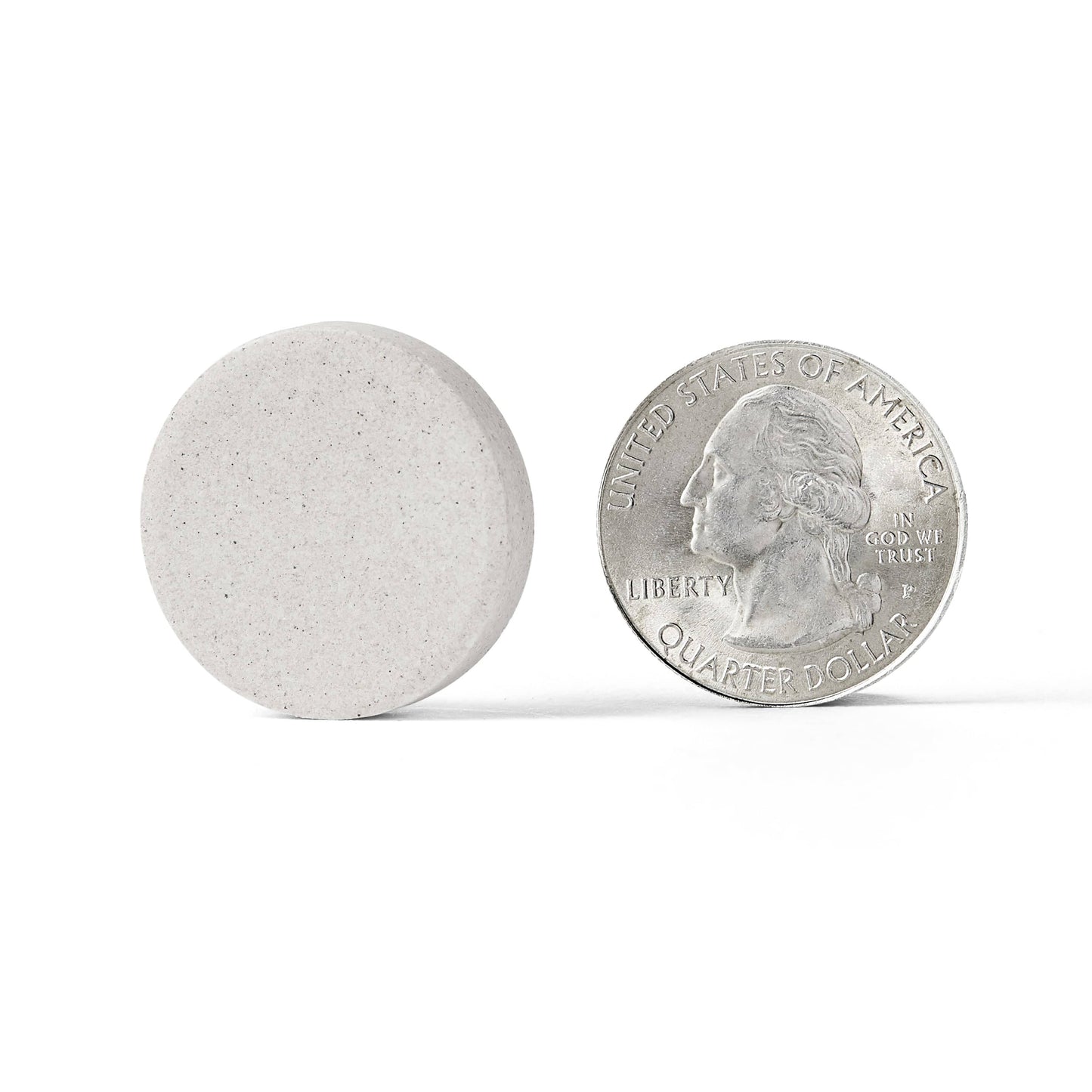 Silver coin next to Airborne Vitamin C Very Berry Immune Support tablet