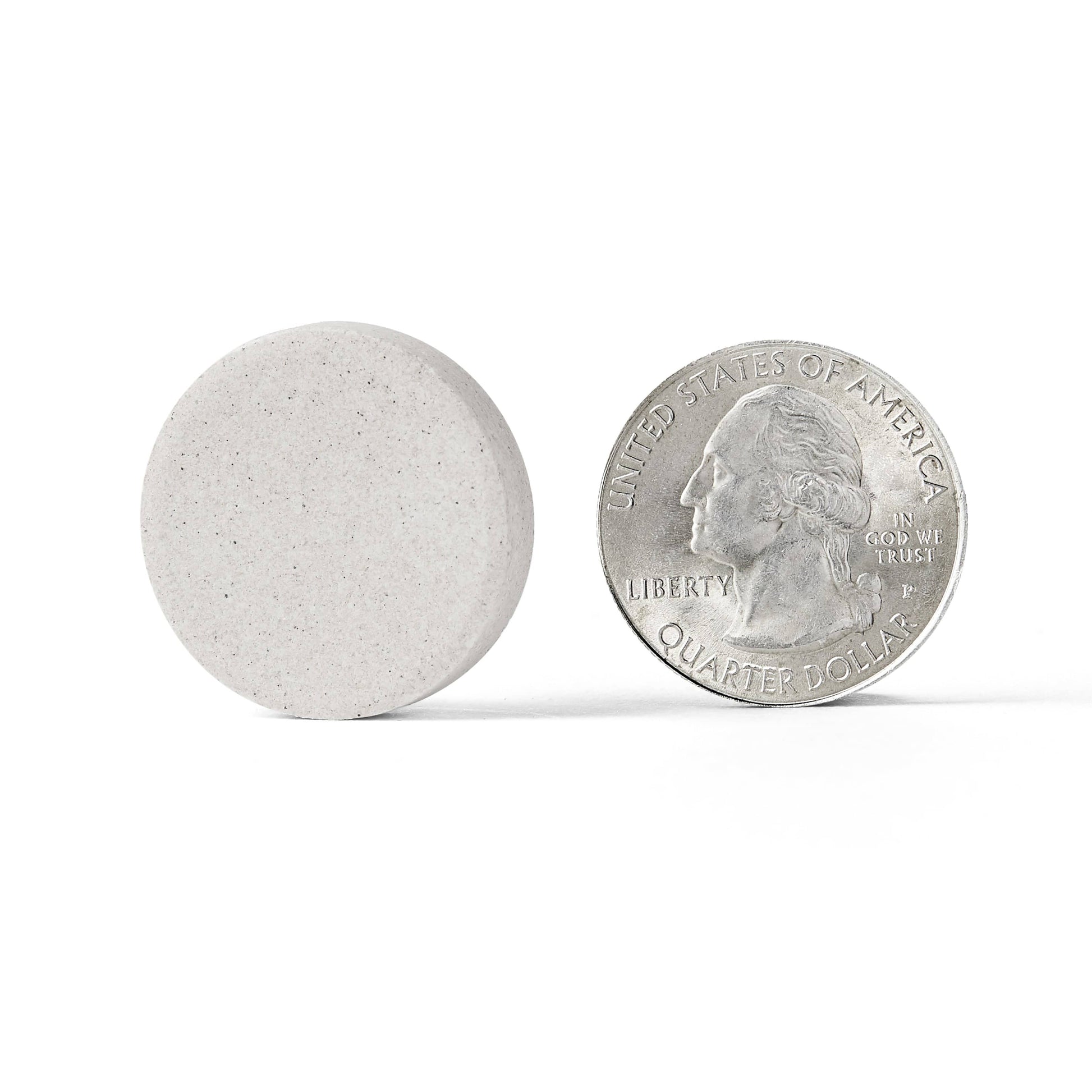 Silver coin next to Airborne Vitamin C Very Berry Immune Support tablet