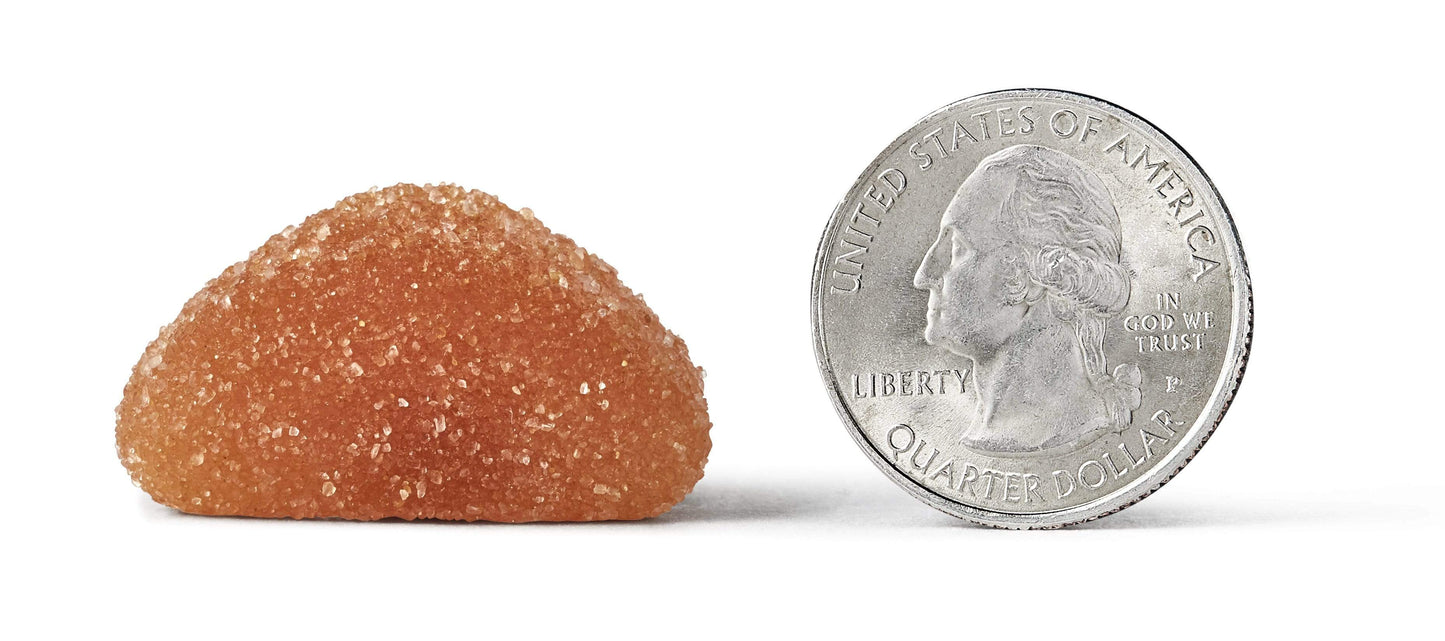 Quarter coin next to an Airborne Immune Support gummy